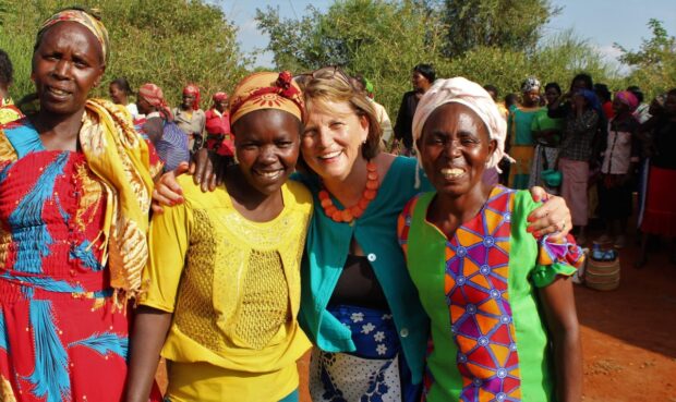A tourist poses with the locals women-entertaining-a-tourist