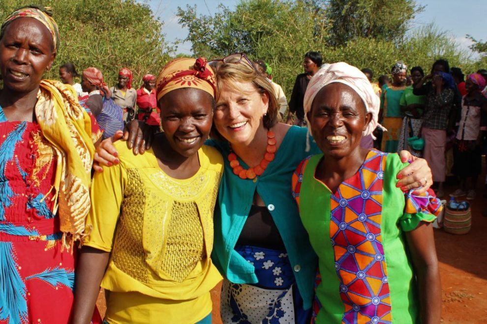 A tourist poses with the locals women-entertaining-a-tourist