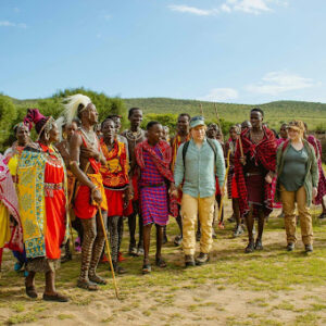 Tourists-interacting-with-locals-during-a-storytelling-or-dancing-session