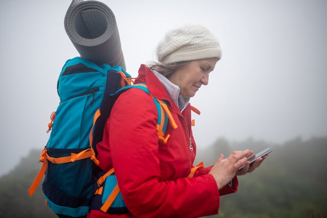 Solo-female-traveler-checking-phone-for-directions