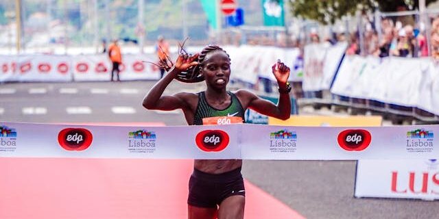 Athletes racing in a Kenyan marathon event Athletes-racing-in-a-Kenyan-marathon-event