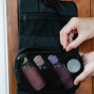 Travel-toiletry-organizer-with-mesh-compartments-and-personal-care-items