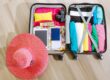 Essential-items-for-women-travelers-packed -n-a-suitcase-prepared -or-a-trip